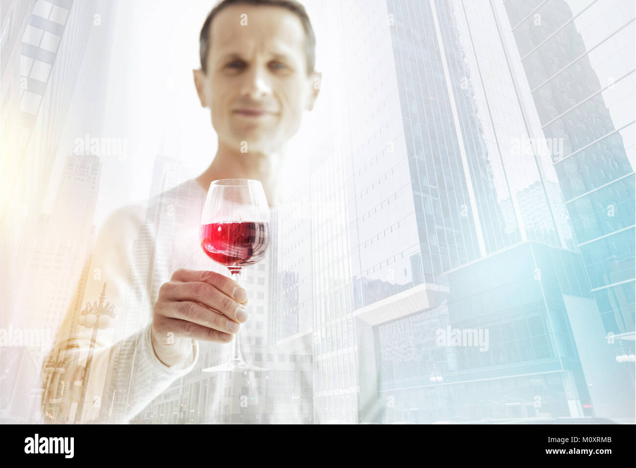 Pleased man holding glass hi-res stock photography and images - Alamy