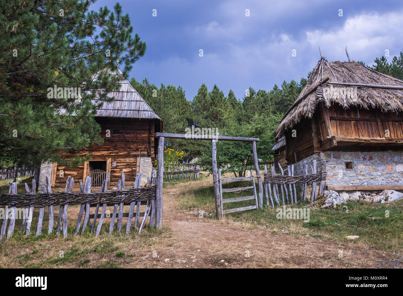 Wooden cottages in Ethnographic heritage park called Old Village Museum in Sirogojno village, Zlatibor region in western part of Serbia Stock Photo