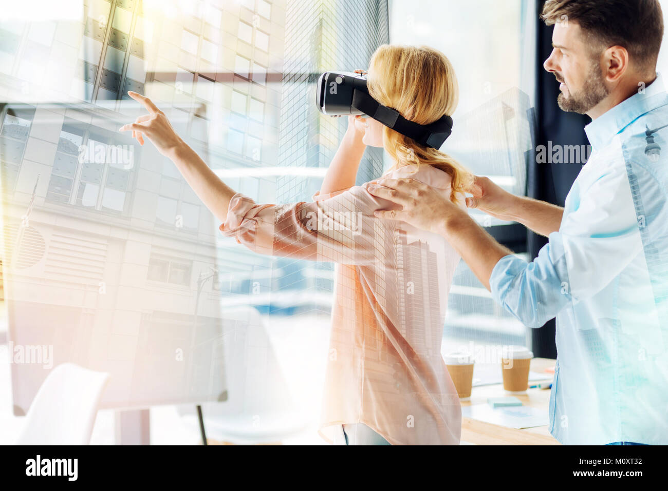 Amused woman with virtual reality glasses Stock Photo