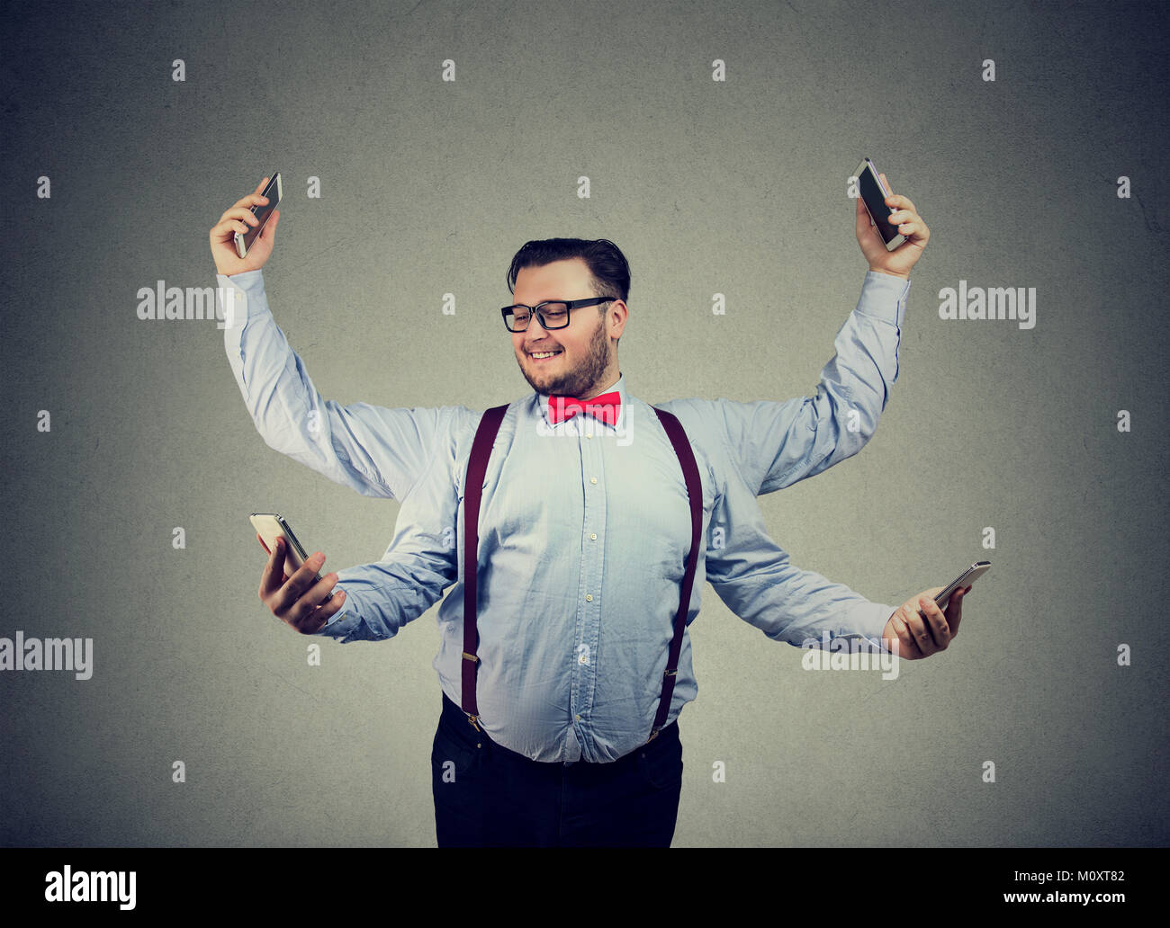 chunky-young-man-in-formal-clothing-having-four-arms-and-using-smartphones-M0XT82.jpg