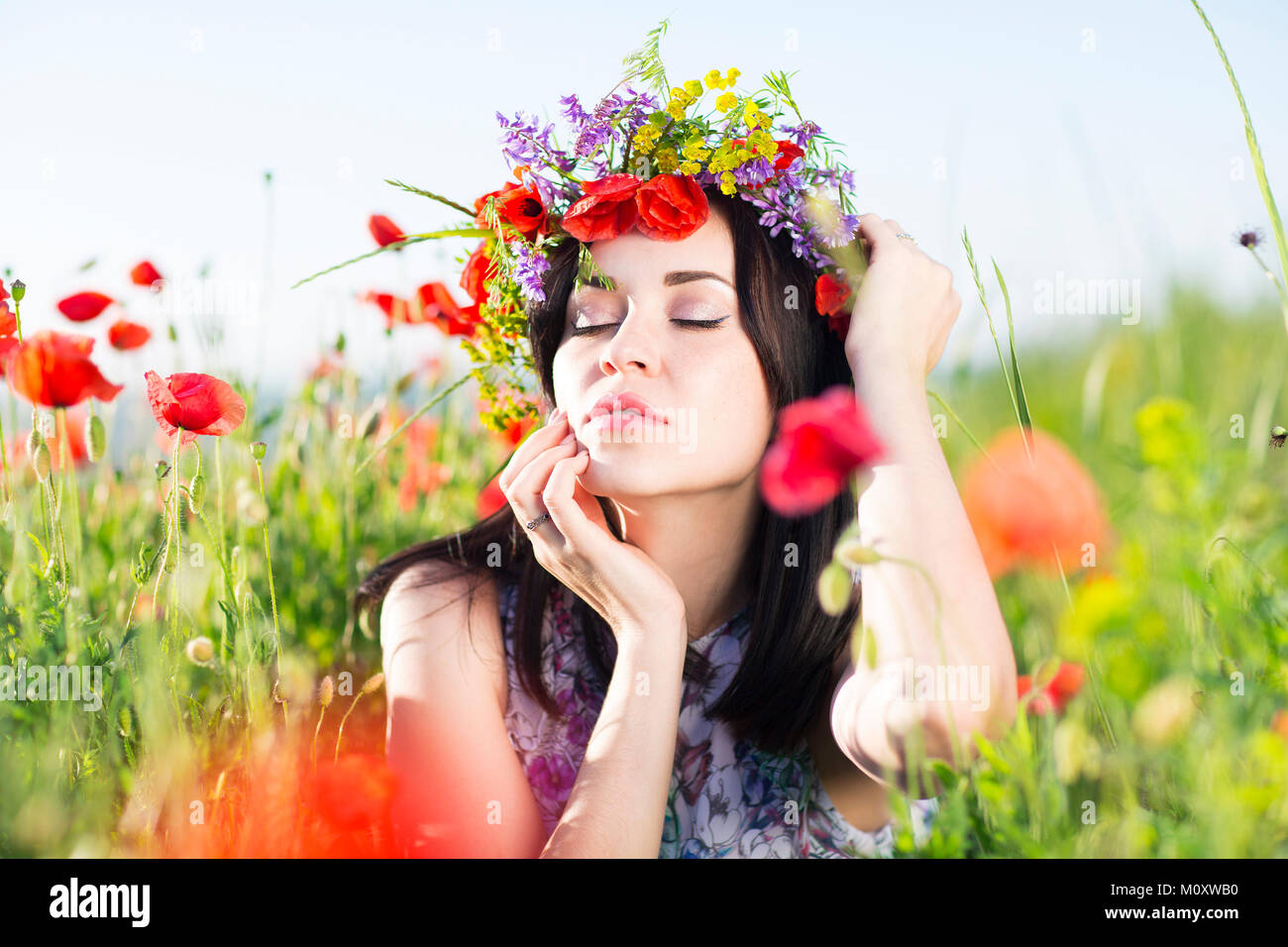 Portrait of young pretty girl with flower wreath Stock Photo - Alamy