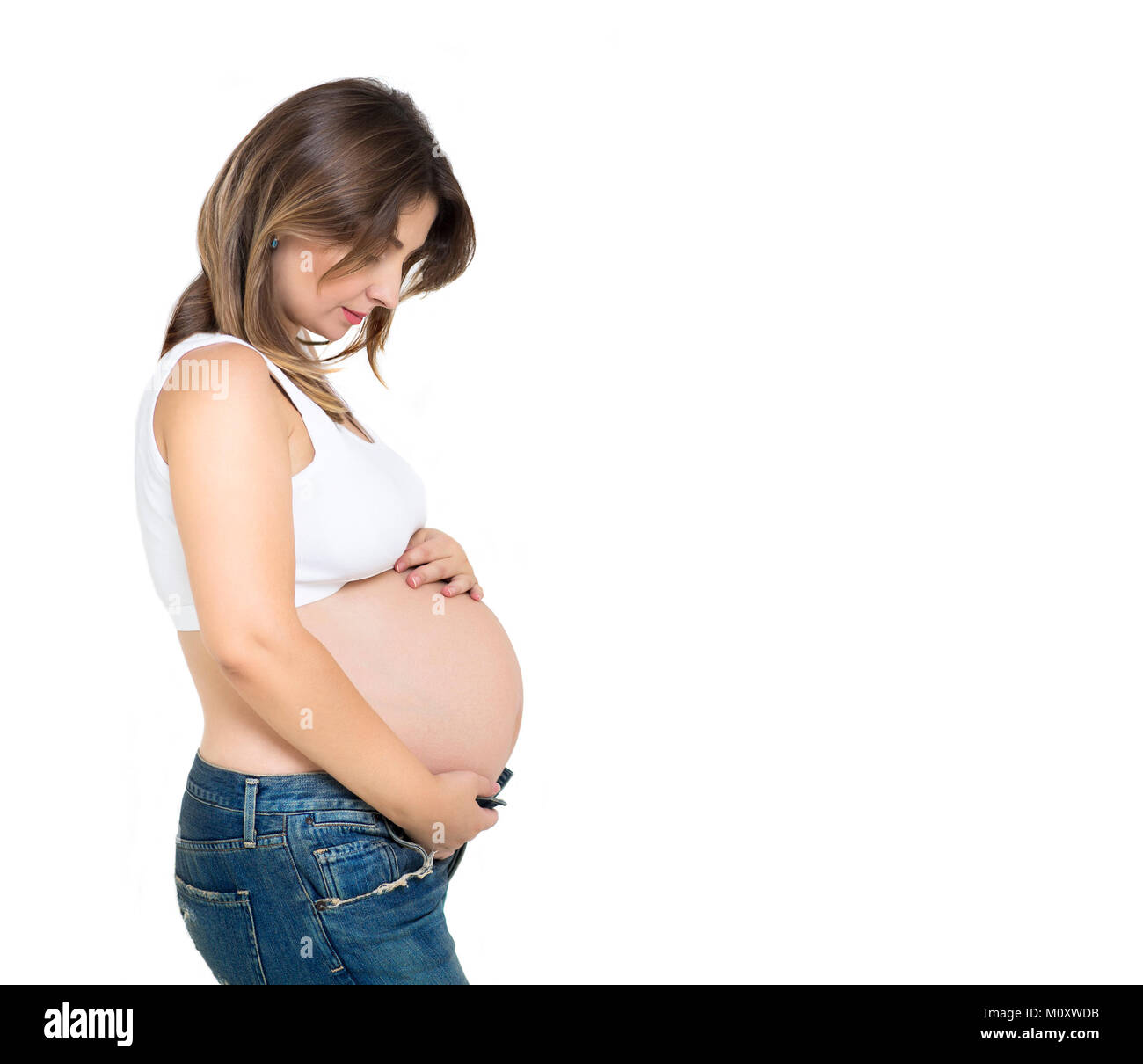 Pretty pregnant woman indoors on white background Stock Photo