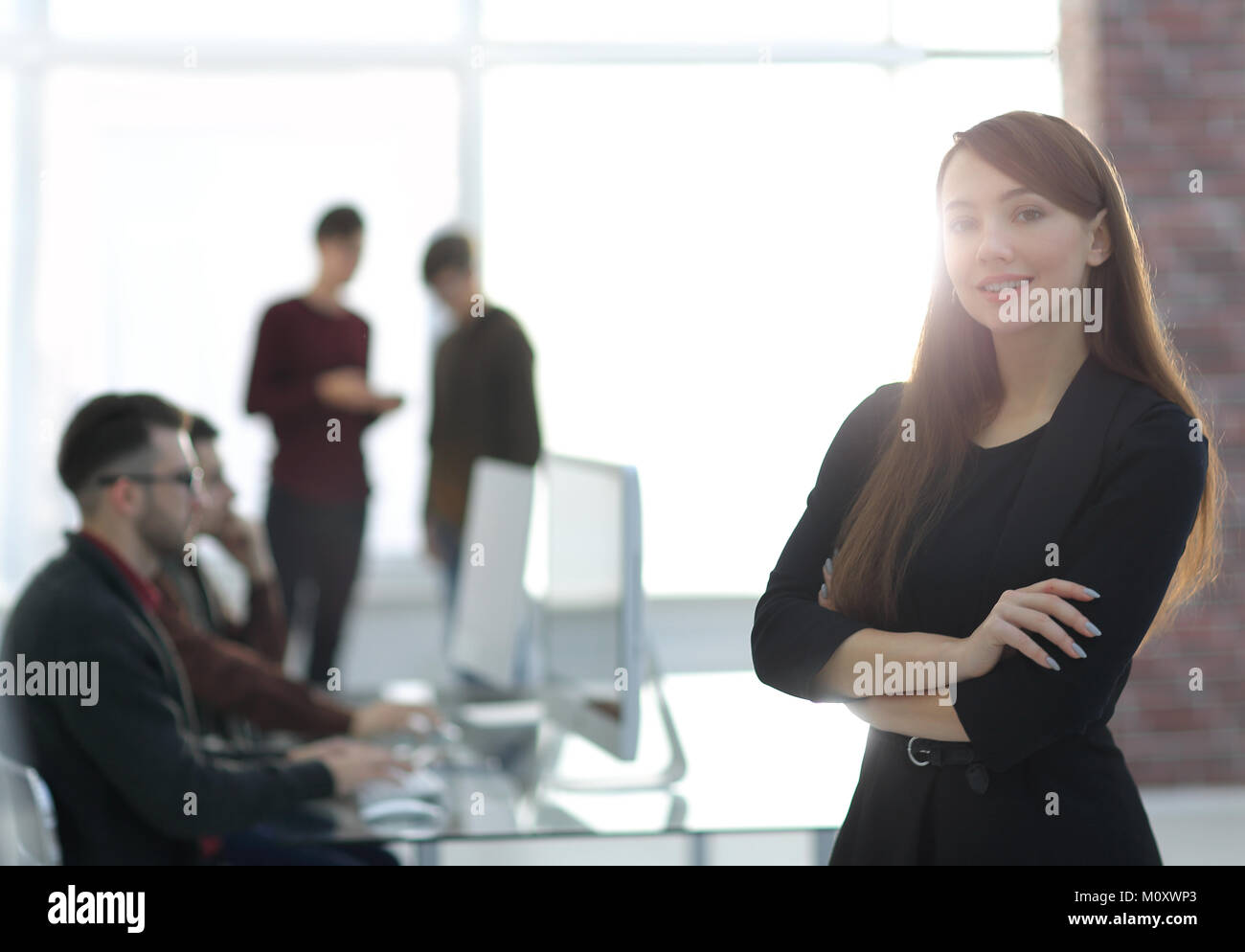 business woman on blurred background office Stock Photo