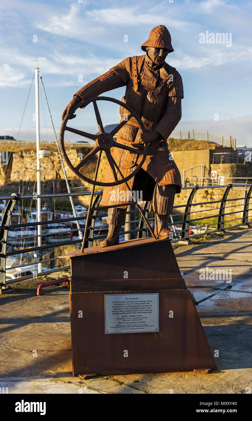 The coxswain statue at Seaham harbour, county Durham in tribute to members of Seaham Lifeboat Station including those who sacrificed their lives. Stock Photo