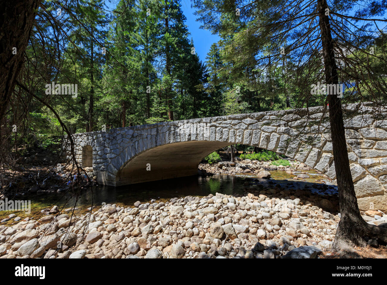 Bridge and Merced river and forest at Yosemite National Park, California, USA Stock Photo