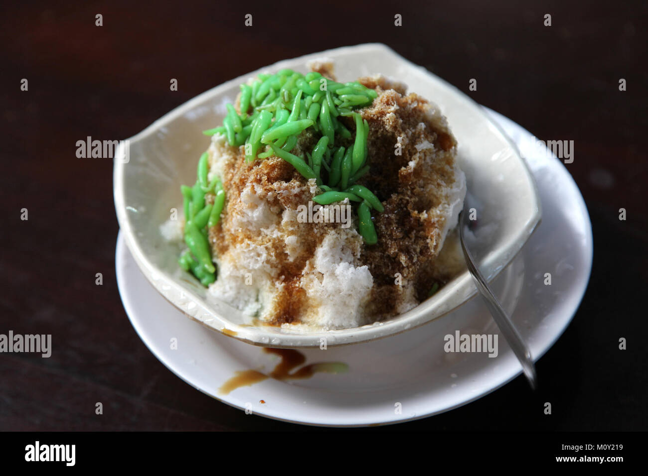 Singapore shaved ice Cendol dessert with green pandan jelly in coconut