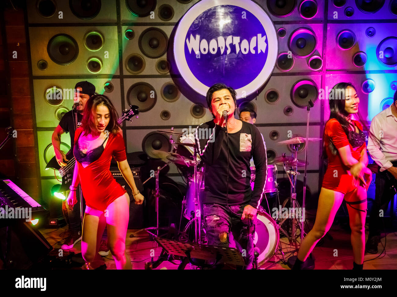 Local live rock band with exotic dancers playing at Woodstock, a night club in downtown Saigon (Ho Chi Minh City), south Vietnam, southeast Asia Stock Photo