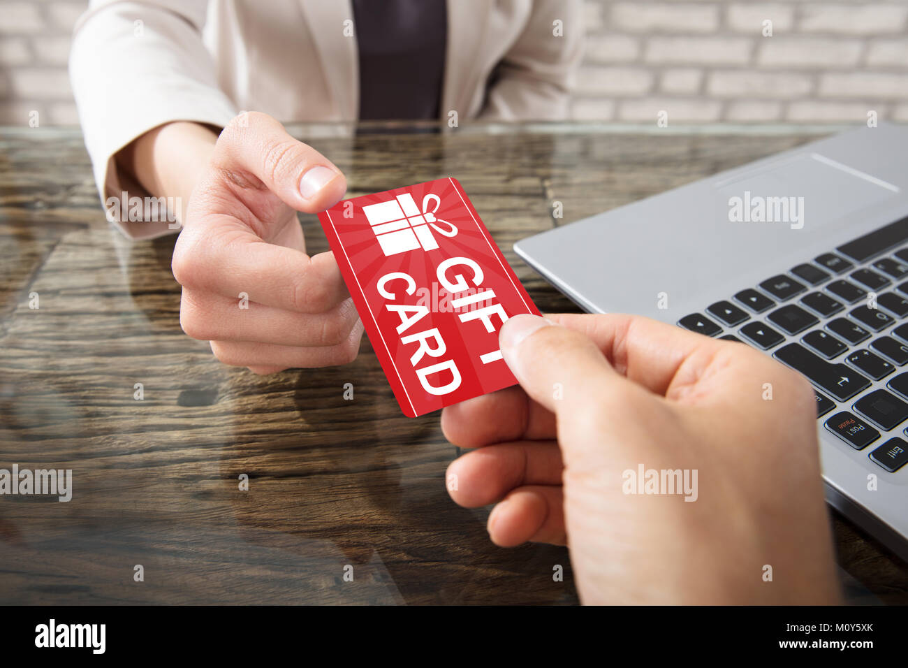 Closeup Of Two Hands Holding Gift Card Stock Photo Alamy