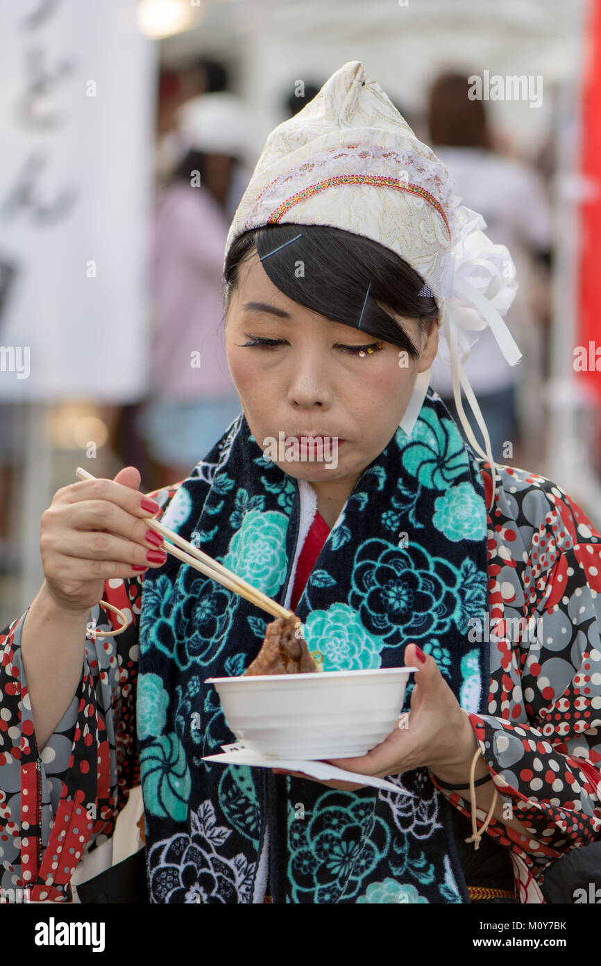 Traditional Japanese dancer eating Stock Photo