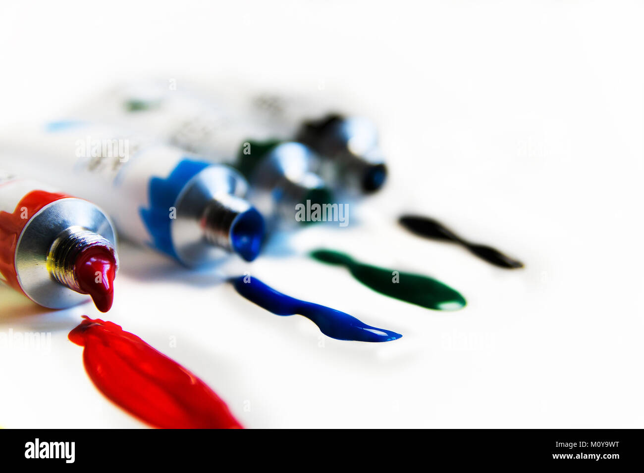 red, blue, green, black colored acrylic paints for drawing in tubes Stock Photo