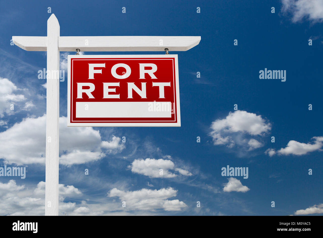 Right Facing For Rent Real Estate Sign Over Blue Sky and Clouds With ...