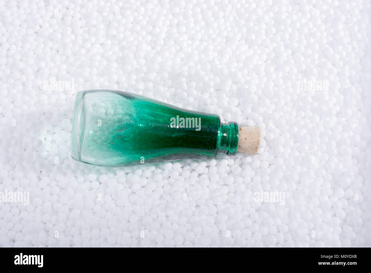 Empty bottle on little white polystyrene foam balls Stock Photo - Alamy