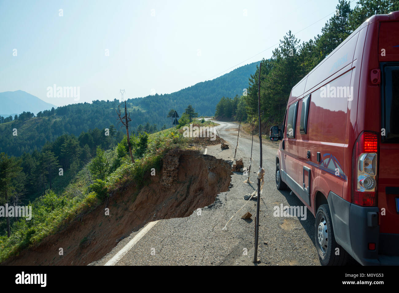 Road damage,roadside of mountian road by erosion broken away,Albania Stock Photo