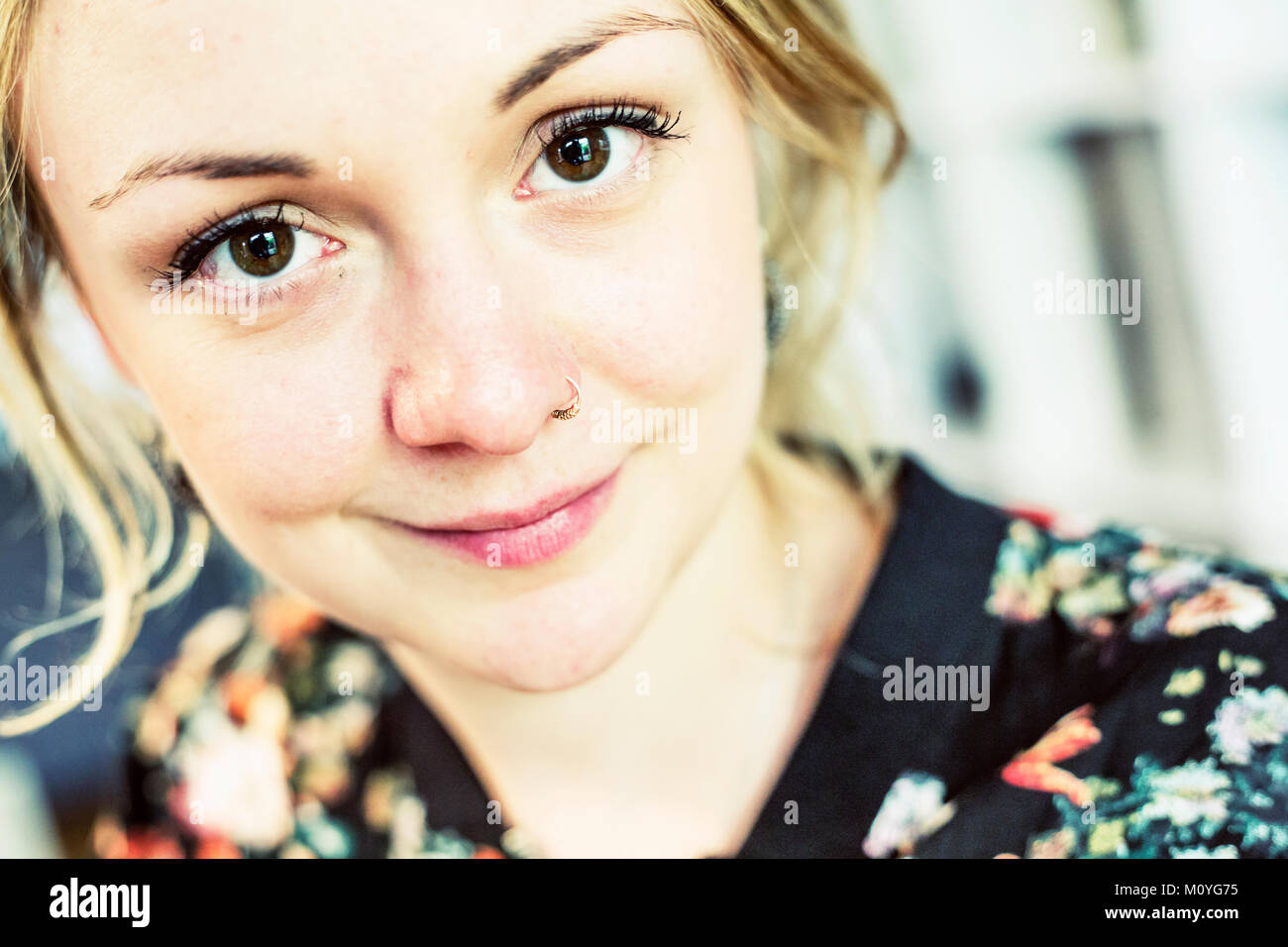Young woman with nose piercing,portrait,Germany Stock Photo