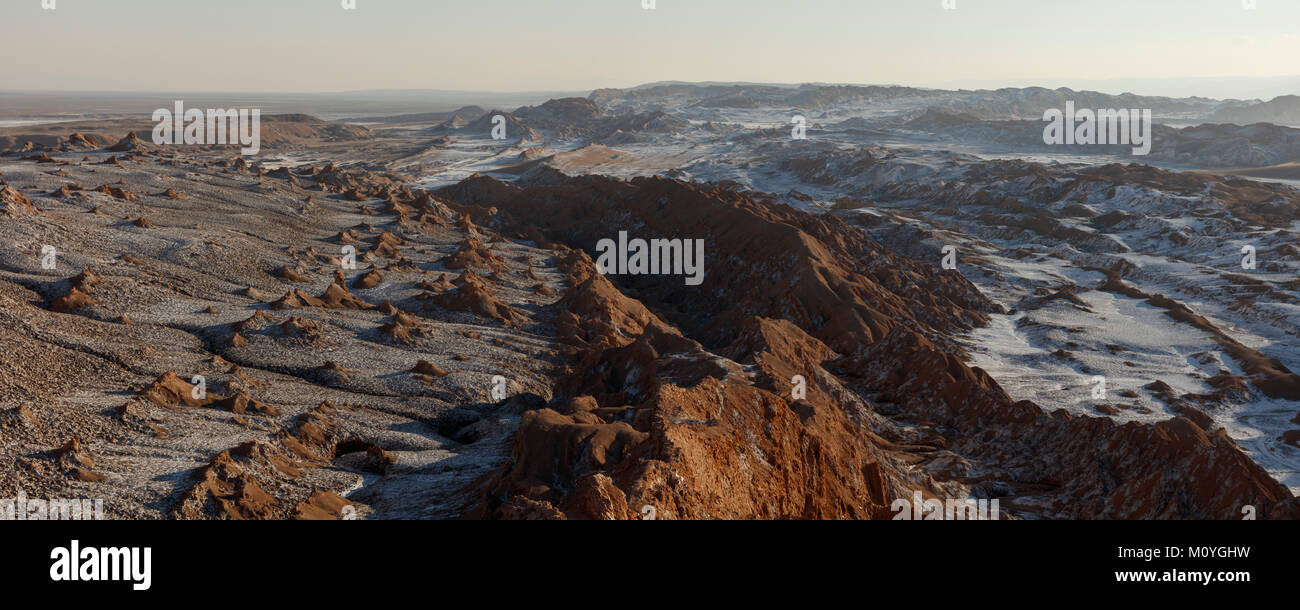Bizarre red rock formations with white salt,Valle de la Luna,San Pedro de Atacama,Chile Stock Photo