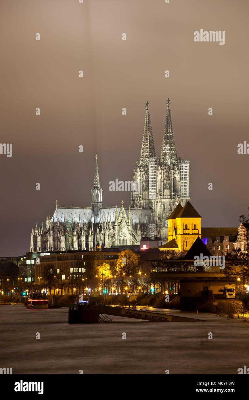 Germany, Cologne, high tide of the river Rhine, flooded promenade, view to the cathedral and to the church St. Kunibert.  Deutschland, Koeln, Hochwass Stock Photo