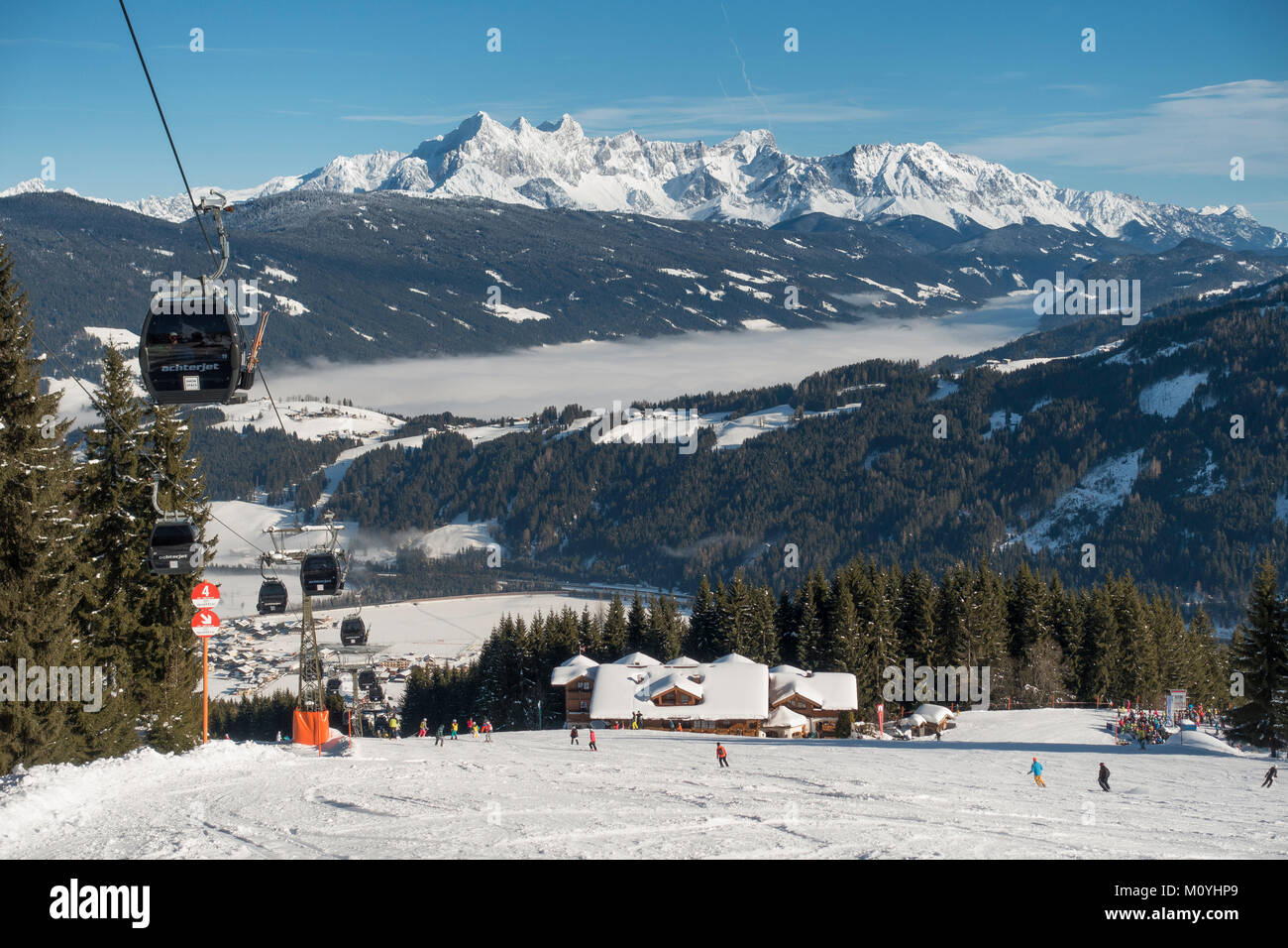 Ski slope with ski lift at the Griesenkareck,1991m,region Ski amade',behind Dachstein massif,community Flachau Stock Photo
