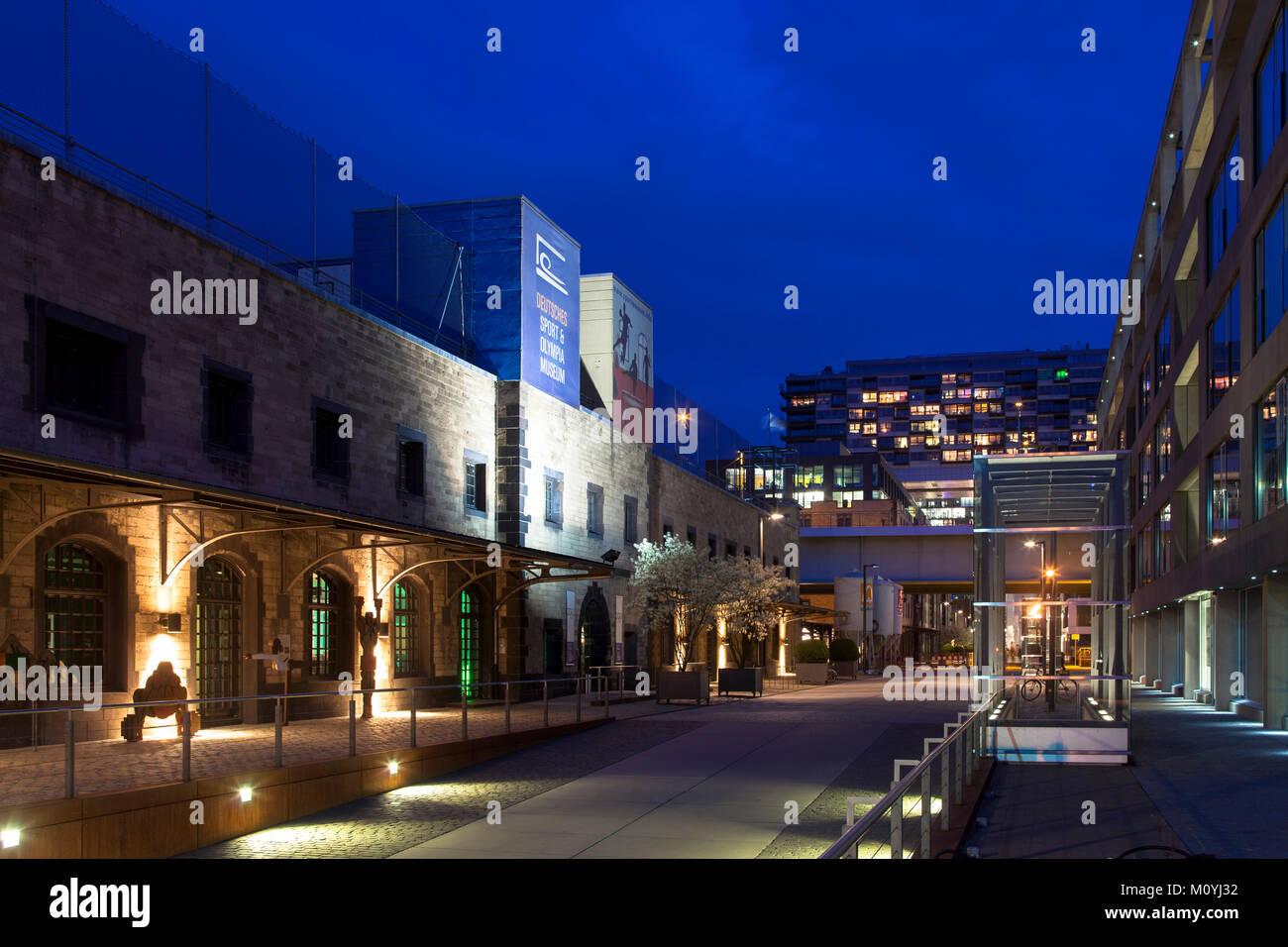 Germany, Cologne, the Rheinau harbour, on the left the German Sport and Olympic Museum, in the background the Crane Houses by architect Hadi Teherani. Stock Photo