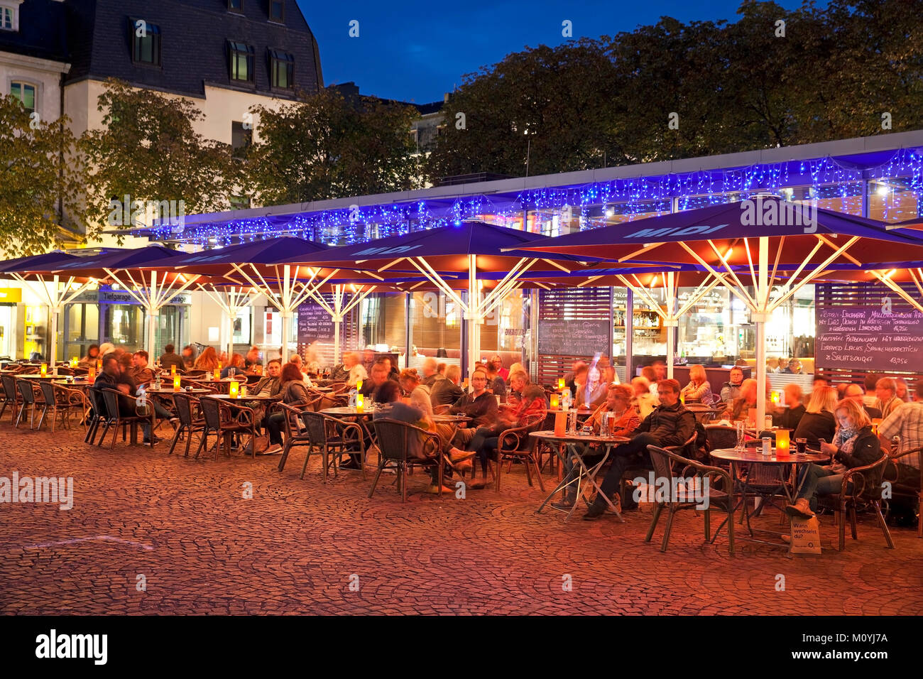 Outdoor catering at Münsterplatz in the evening,Bonn,North Rhine-Westphalia,Germany Stock Photo