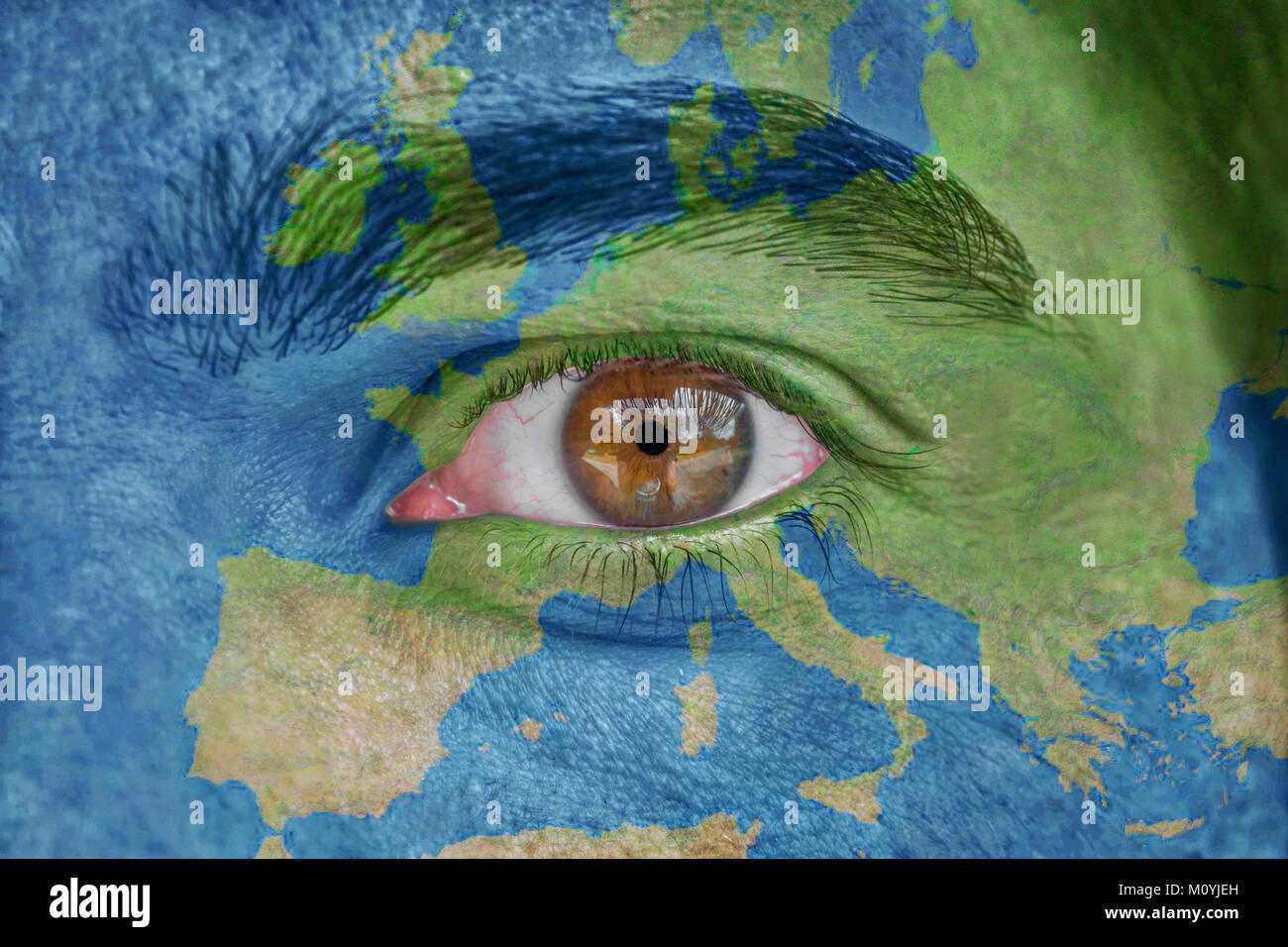 Human face and eye painted with europe space geography map Stock Photo