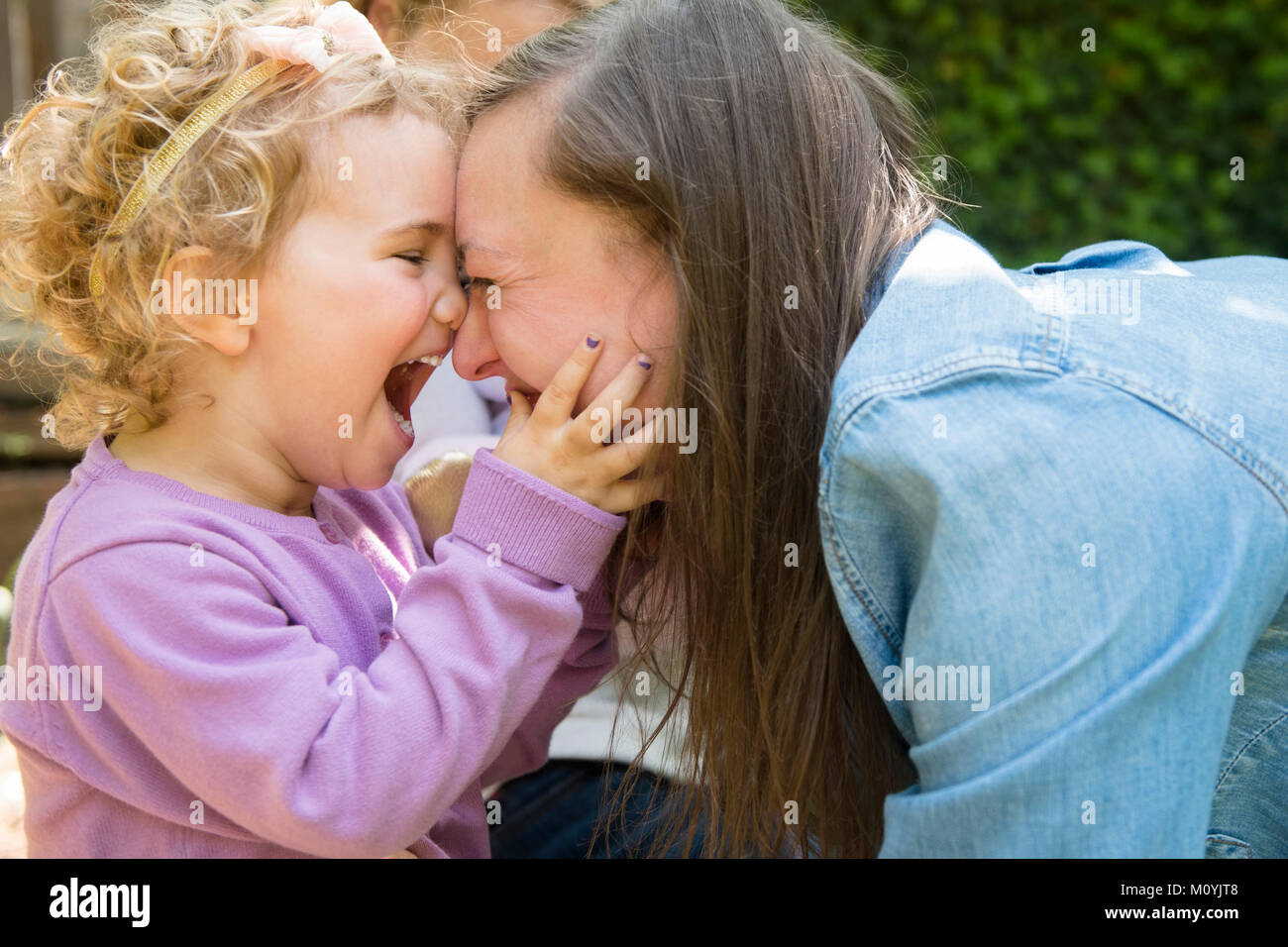 Caucasian mother and daughter laughing Stock Photo