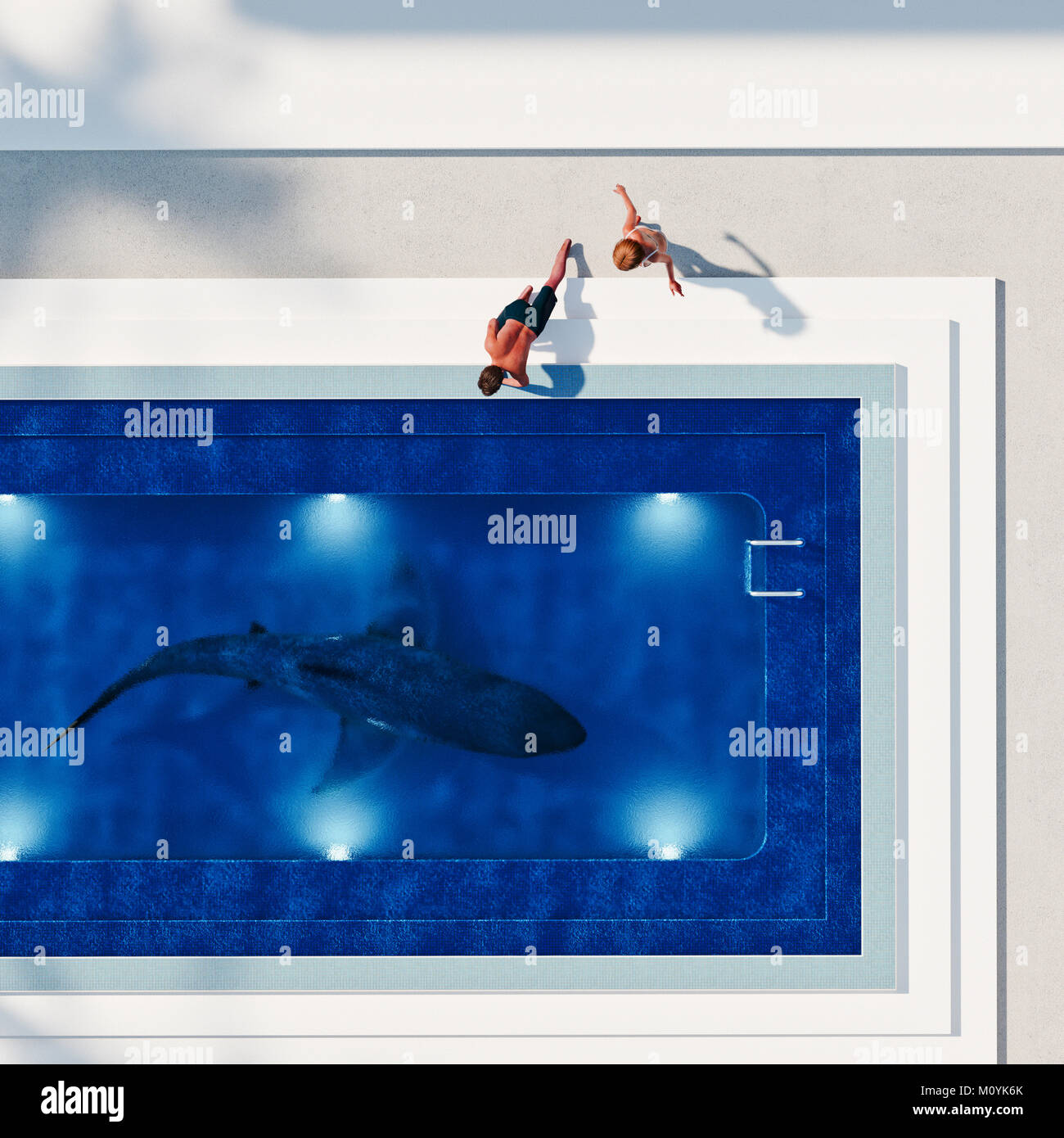 Couple watching shark in swimming pool Stock Photo
