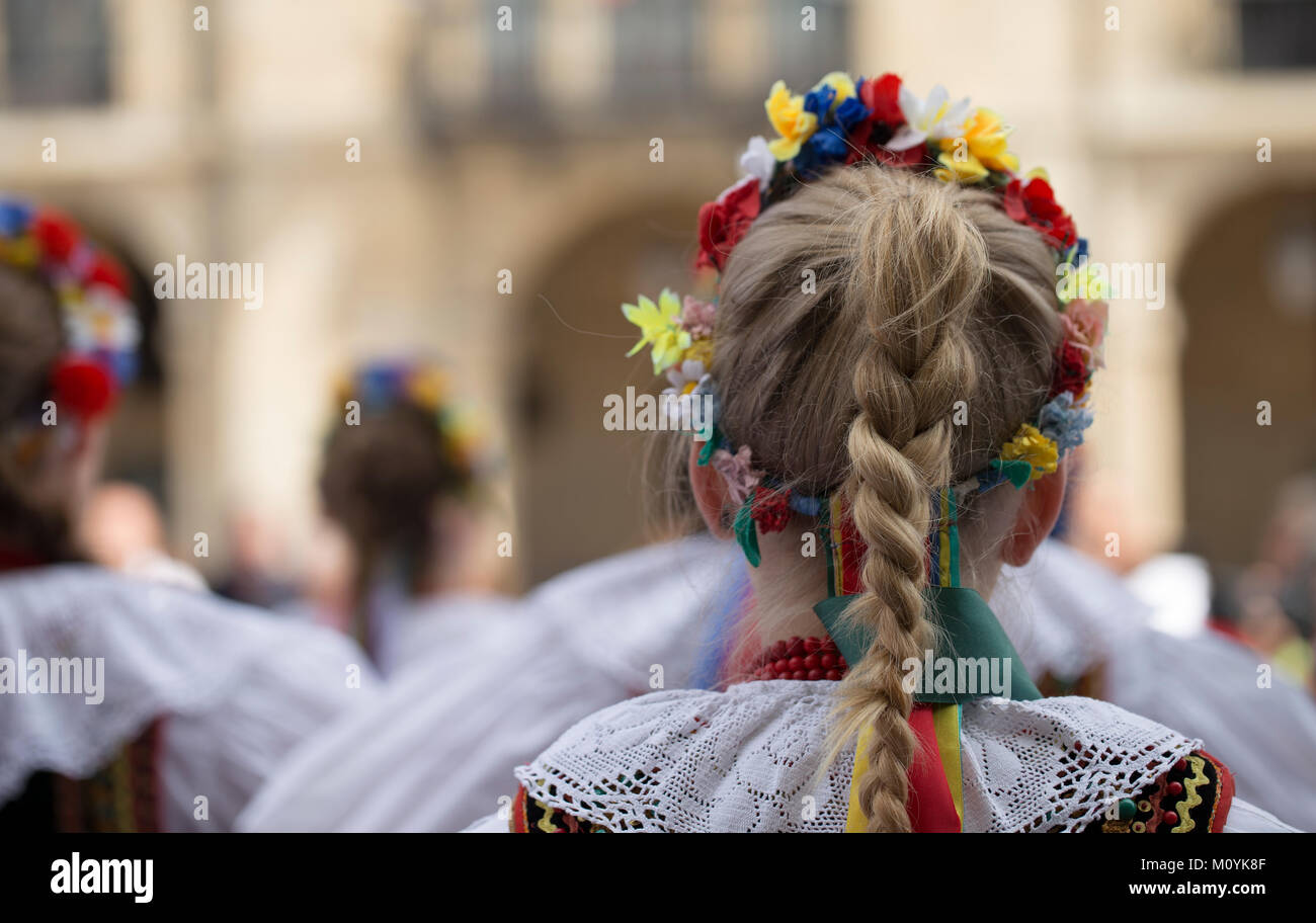 Rear view of a polish woman of traditional folk dance group with traditional costume Stock Photo