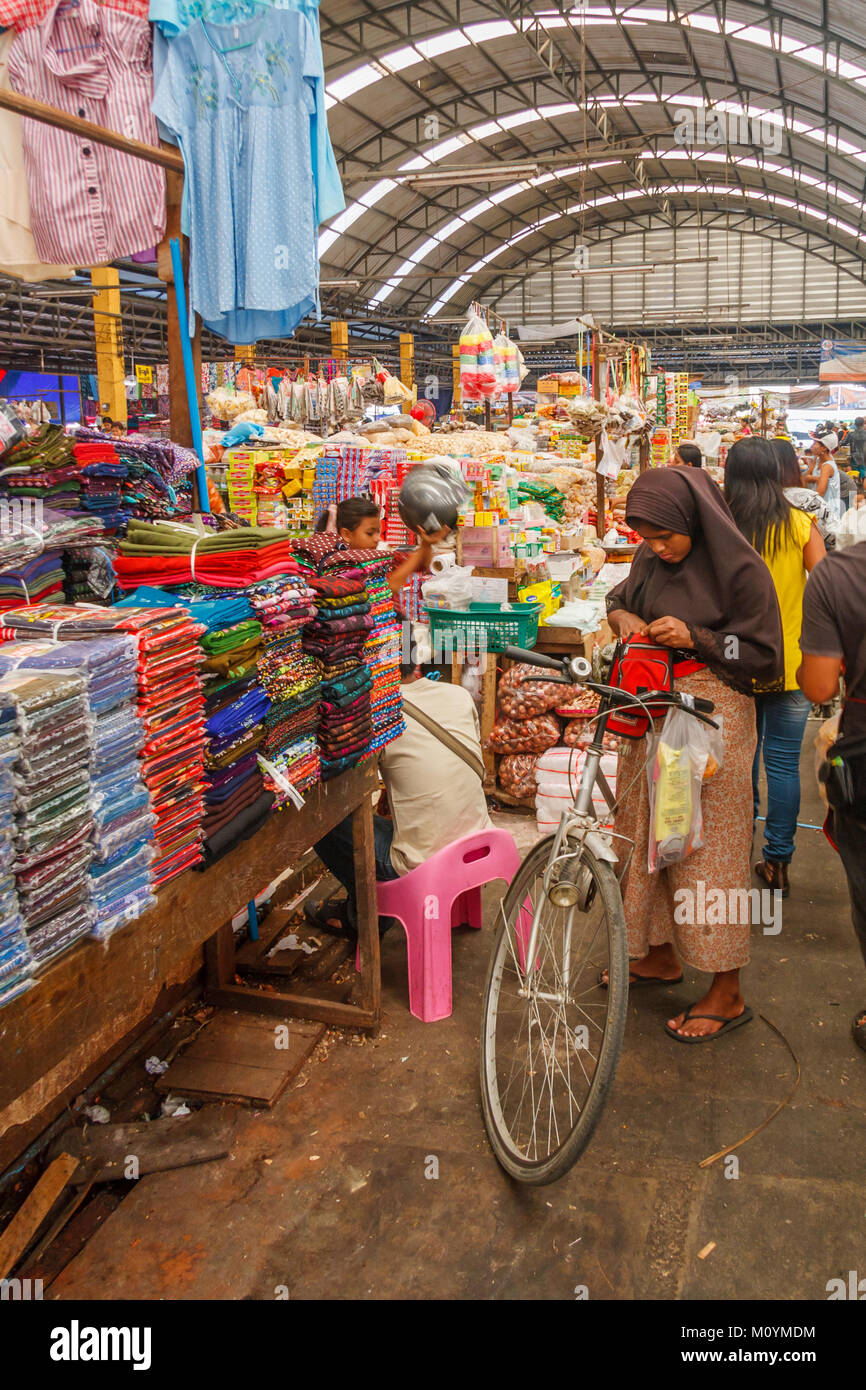 Muslim woman with bicycle, indoor market, Mae SOt, Thailand Stock Photo