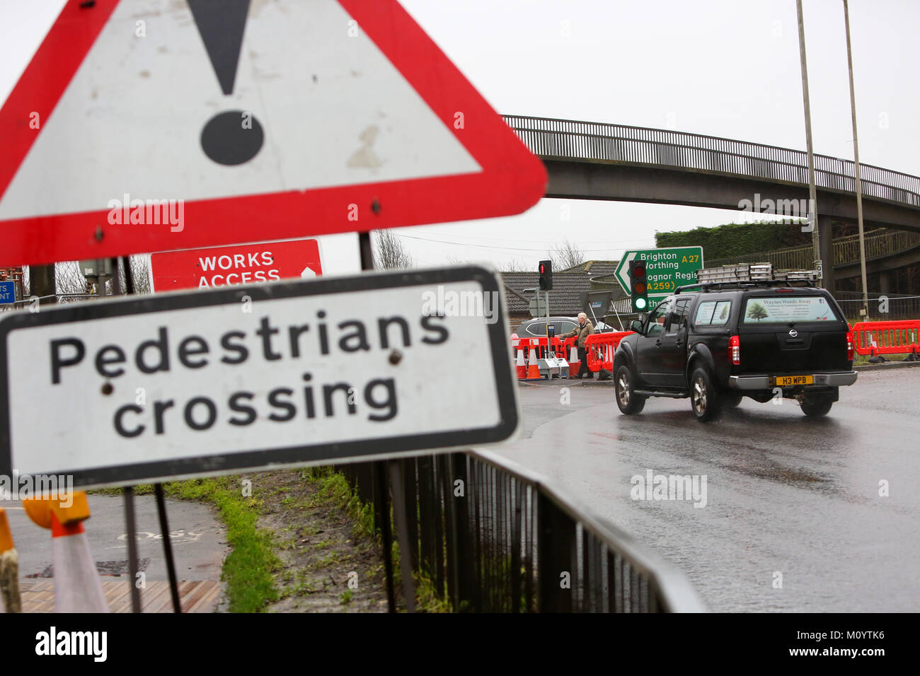 Road works pictured on the A27 in Chichester, West Sussex. Work to a pedestrian footbridge has brought in temporary traffic lights causing delays. Stock Photo