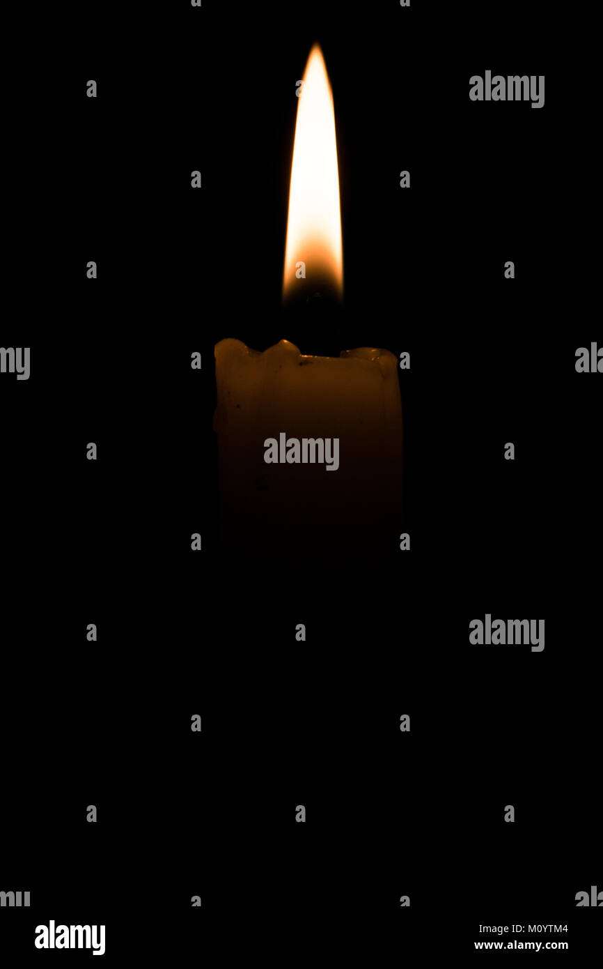 Isolated candle light on black background with space for text Stock ...