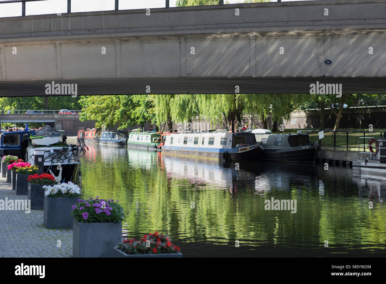 The Paddington arm of the Regents canal with moored boats Stock Photo