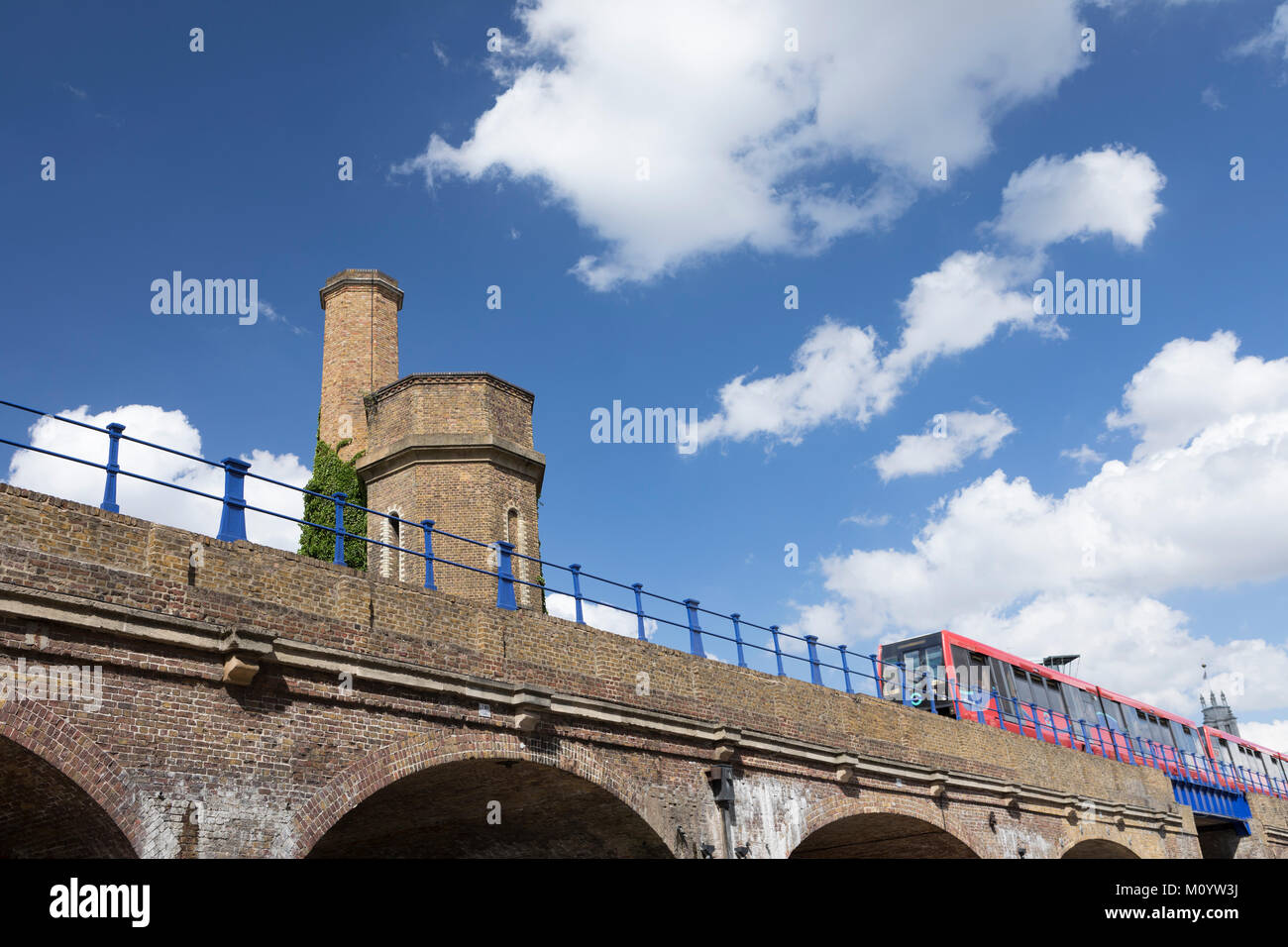 Railway bridge at Limehouse and overland train Stock Photo