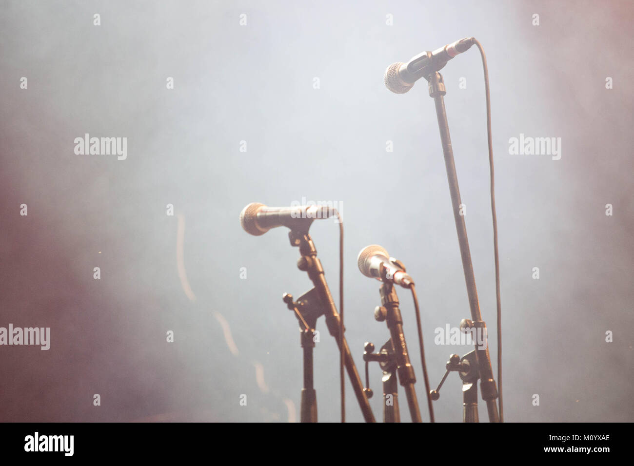 microphones standing on the stage - concert Stock Photo
