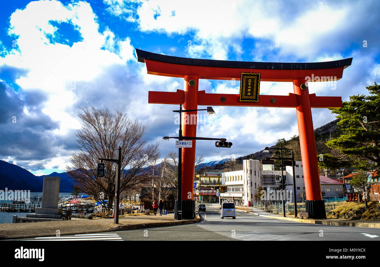 Nikko, Japan - Dec 26, 2015. Giant Torii at sunny day in Nikko, Japan. Nikko is a popular destination for Japanese and international tourists. Stock Photo