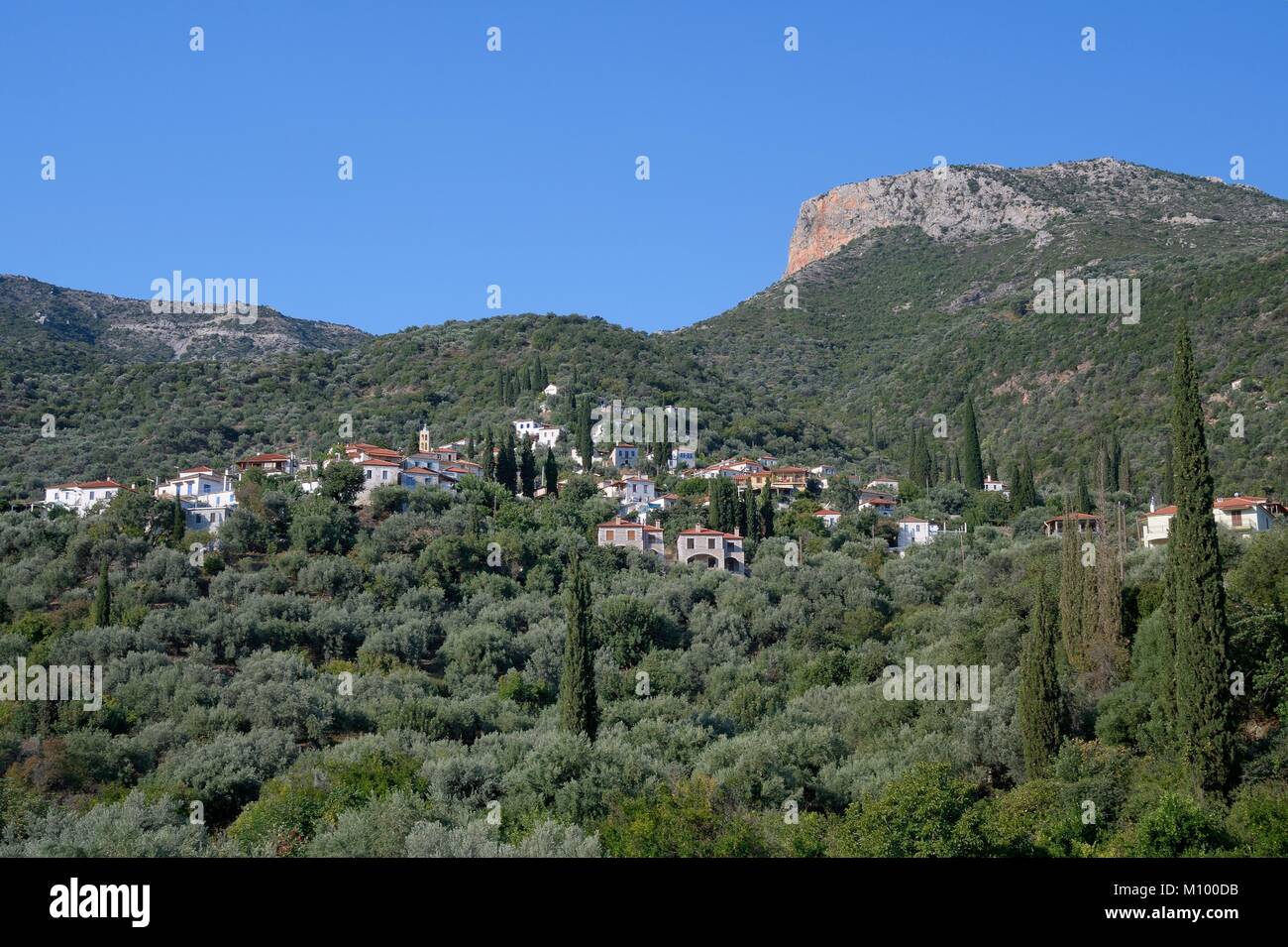 Sapounakeika village, set on wooded mountain slopes among Olive groves and Cypresses near the coastal village of Tyros, Arcadia, Peloponnese, Greece Stock Photo