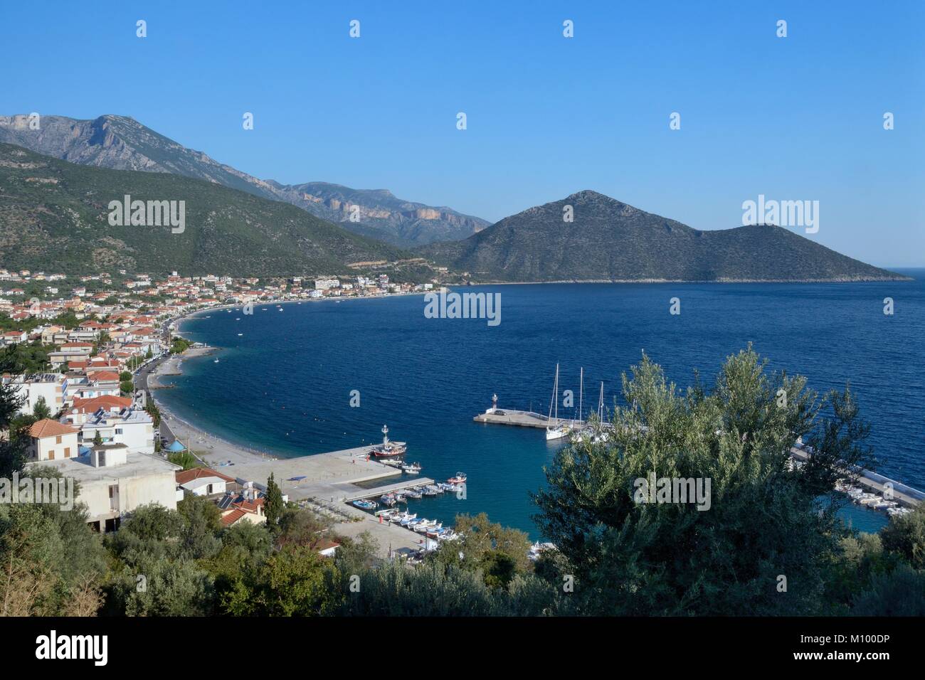 Overview of Tyros harbour and village with the mountains of Arcadia in the background, Peloponnese, Greece, August. Stock Photo