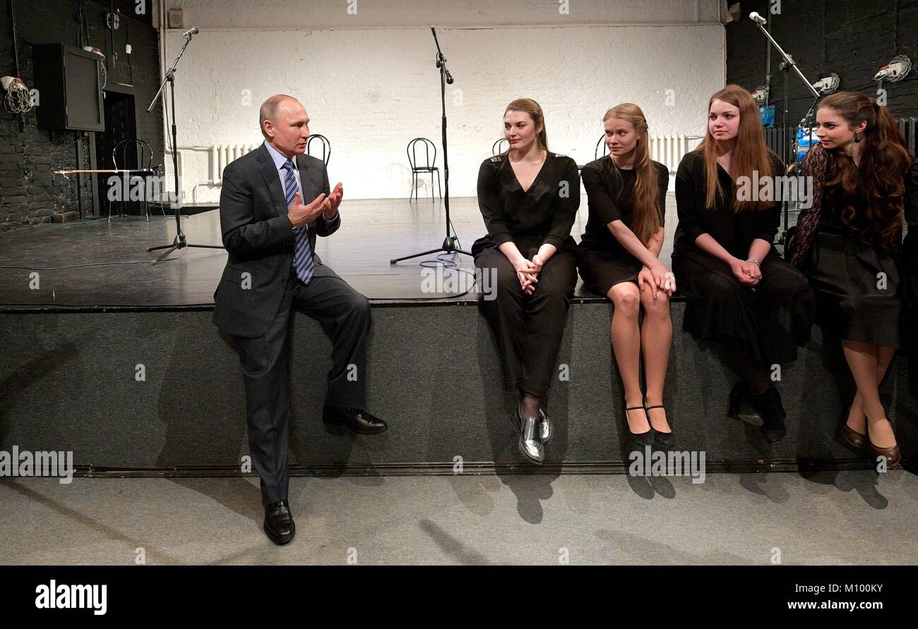 Russian President Vladimir Putin, left, speaks to young actors following a rehearsal of the production “Hello, Vladimir Vysotsky” at the Vysotsky House in Taganka Museum Centre January 24, 2018 in Moscow, Russia. Vysotsky was an iconic Soviet-era singer, poet and actor. Stock Photo