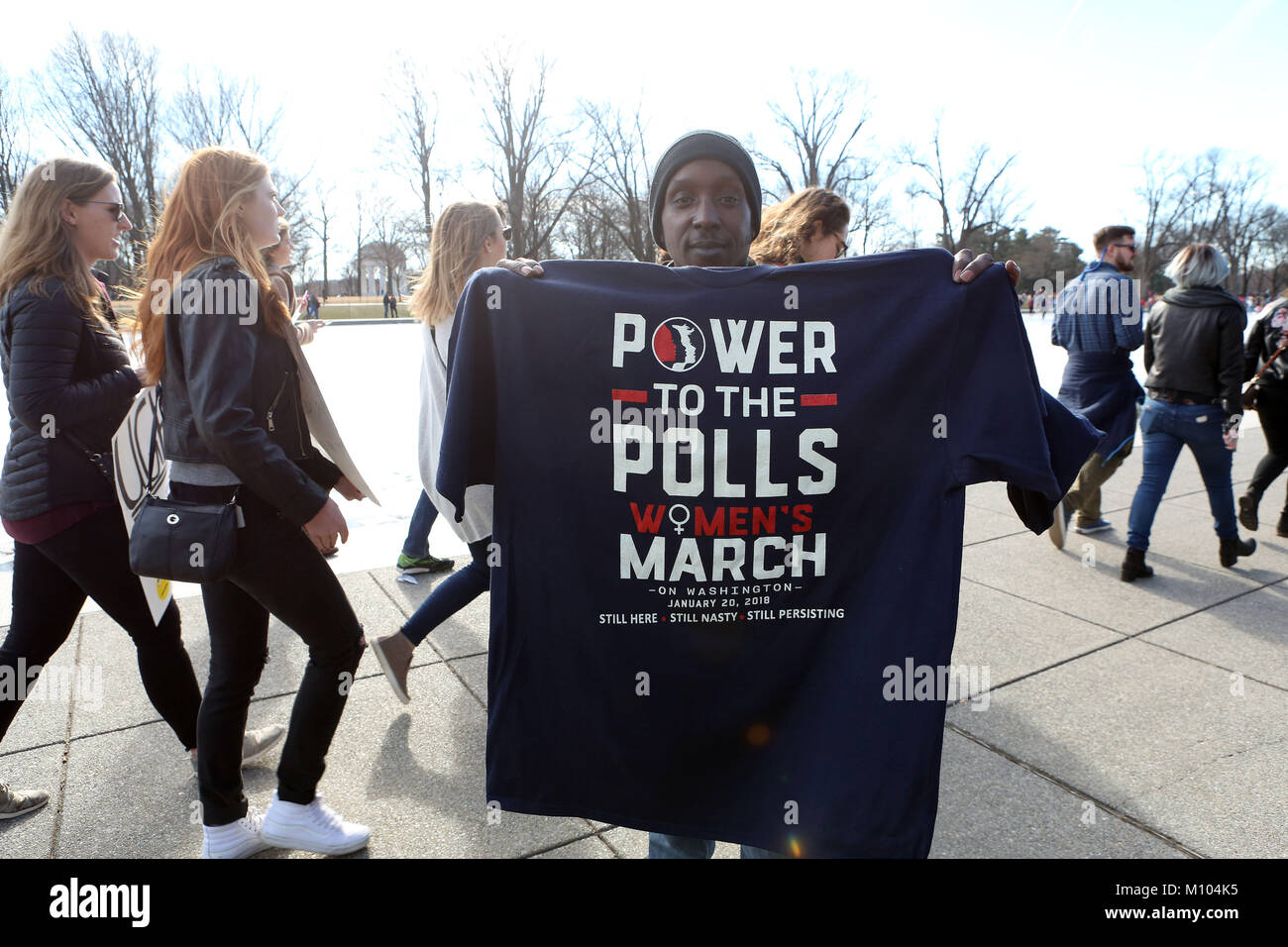 Washington Dc, DC, USA. 20th Jan, 2018. A vendor holds a T-Shirt that reads 'Power to the Polls Women March on Washington January 20, 2018. Still Here Still Nasty Still Persisting.' Thousands of women and their supporters march during the 2018 Women's March on Washington. Credit: Krista Kennell/ZUMA Wire/Alamy Live News Stock Photo