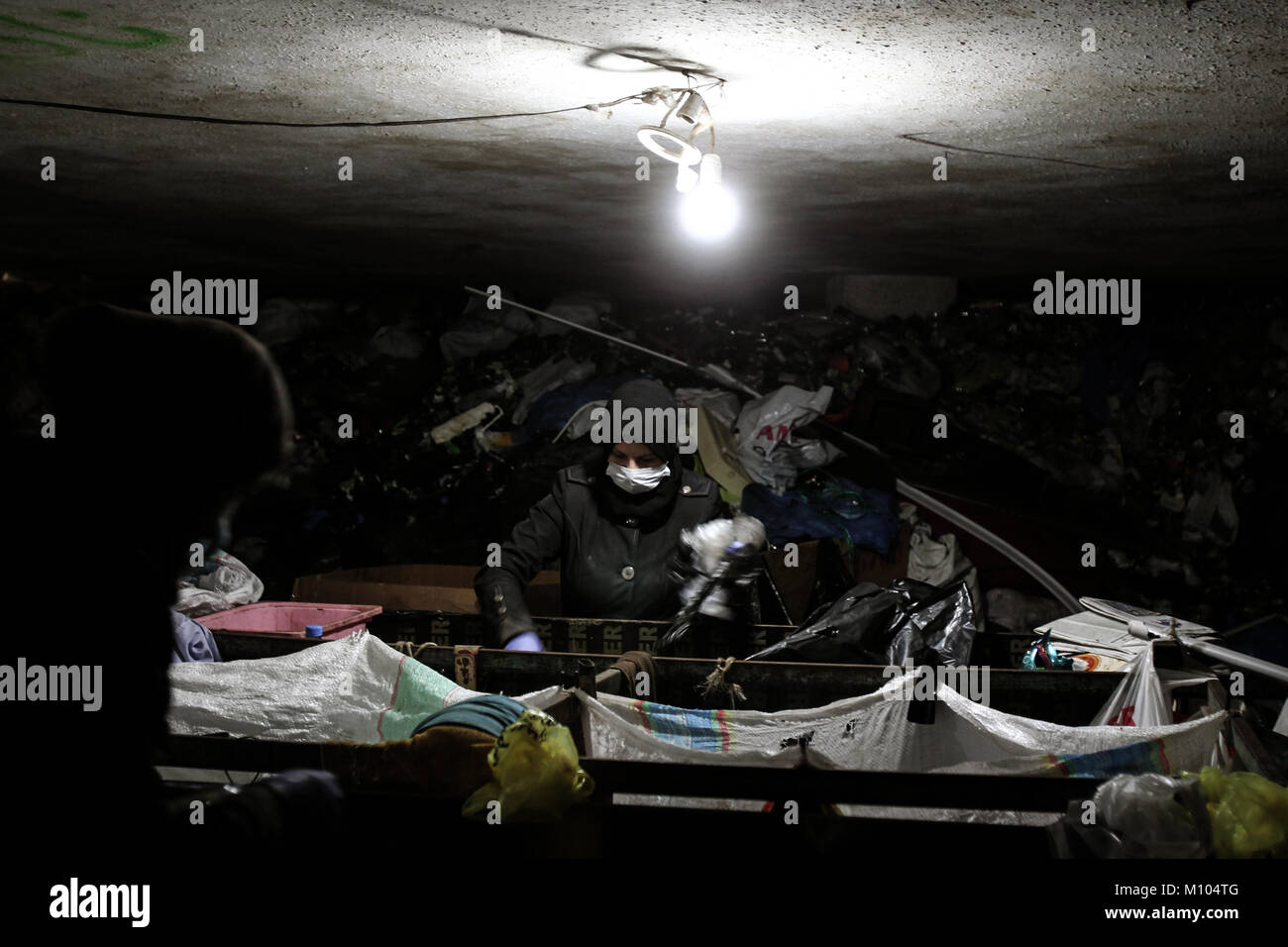 A picture made available on 25 January 2018 shows Syrian refugees working in a private recycling centre established through personal initiative in Beirut, Lebanon, 20 January 2018. The Middle Eastern country is in a perpetual garbage crisis since 2015 and has seen authorities implementing numerous band-aid solutions, from failed recycling centres to random waste burning sites and the opening of the 'temporary' Costa Brava and Bourj Hammoud landfills, situated along Beirut's coastline. Photo: Marwan Naamani/dpa Stock Photo