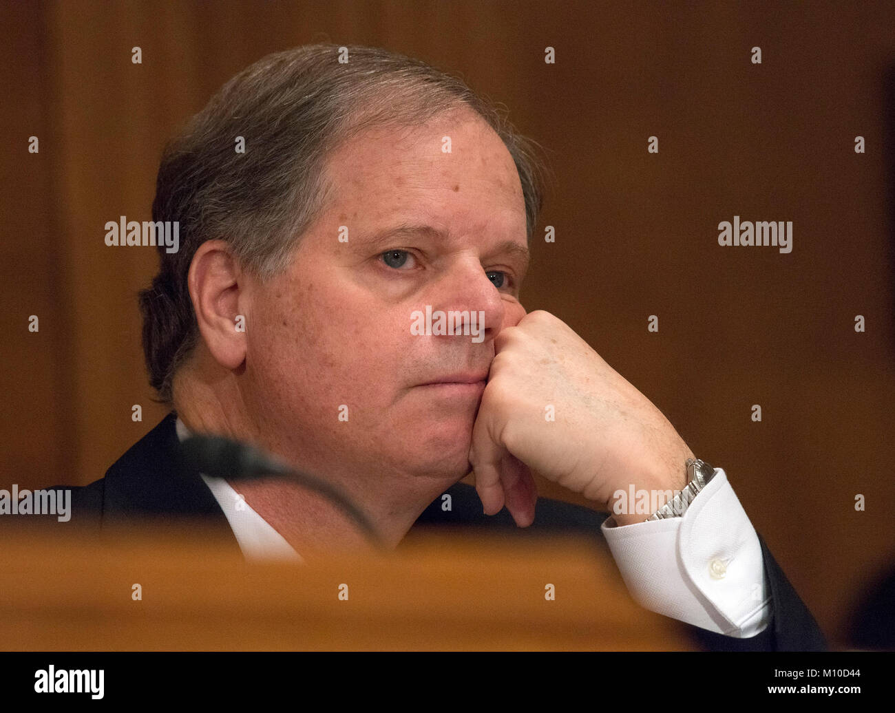 United States Senator Doug Jones (Democrat of Alabama) listens during