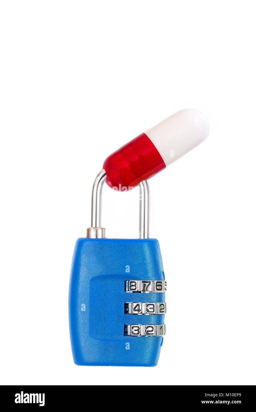 drug capsule red and white trapped in a blue metal padlock on white background copy text Stock Photo