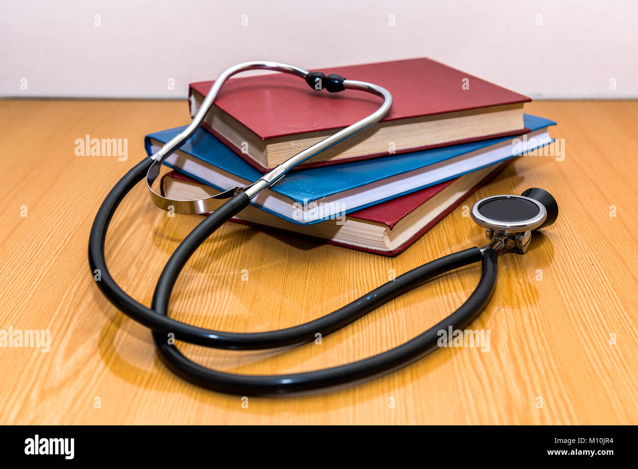 Table of medical student with books and stethoscope. by Pázsint Dalma.  Photo stock - StudioNow