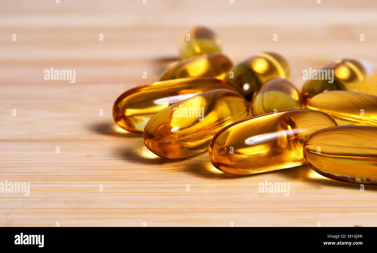 Fish oil pills closeup Stock Photo - Alamy