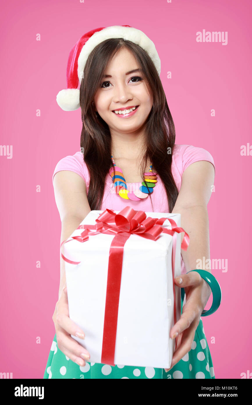 portrait of smiling young woman holding some gift boxes Stock Photo - Alamy
