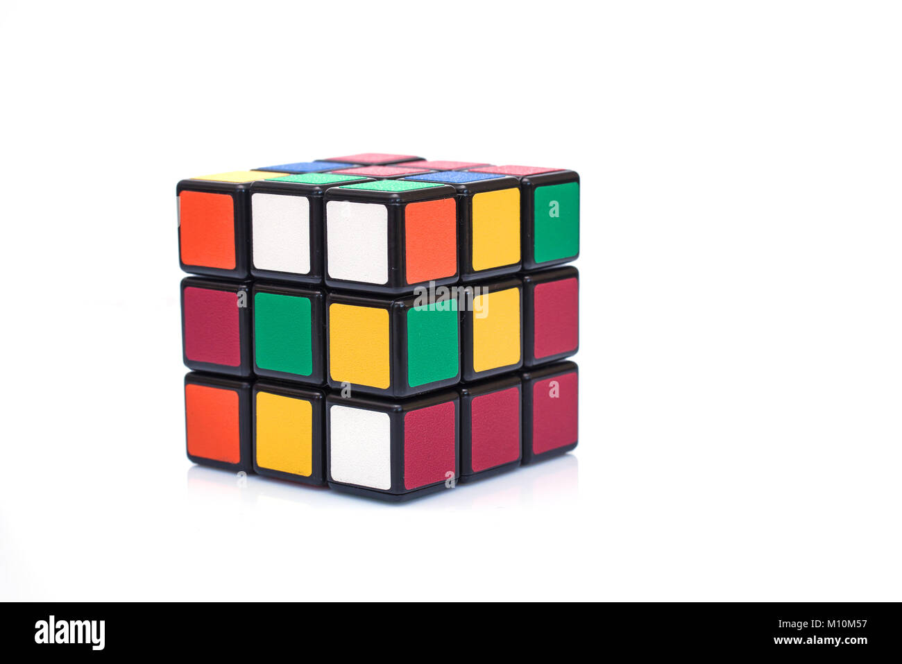PARIS FRANCE - SEPTEMBER 29, 2015: Rubik's cube on the white background. This famous game was invented by a Hungarian architect Erno Rubik in 1974. Stock Photo