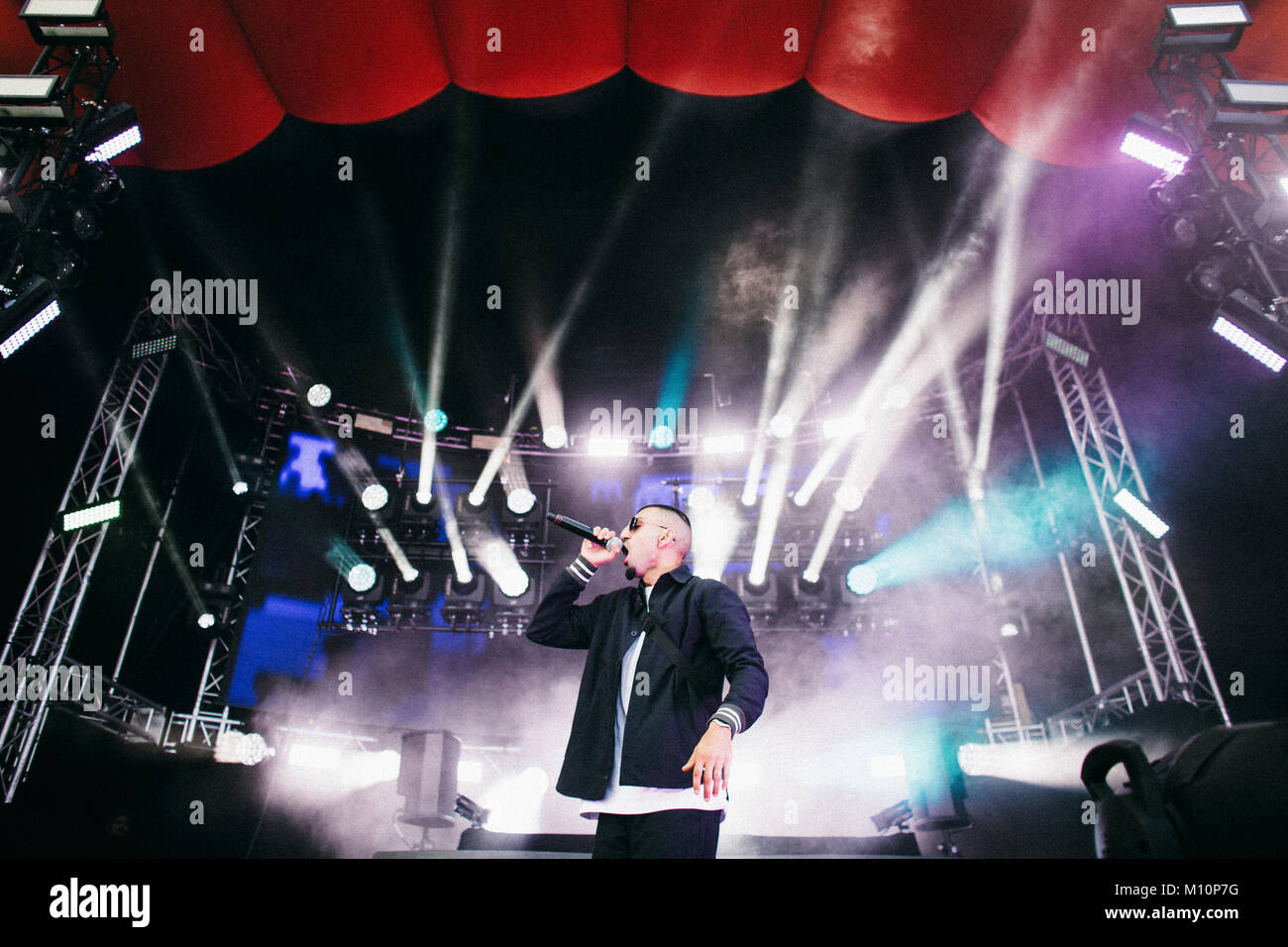 The Danish rapper Sivas (Stylized S!vas) performs a live concert at the Apollo Countdown stage at Roskilde Festival 2014. Sivas mess up the Danish dictionary combining Danish, English and Arabian in one big ghetto mixture. Denmark 02.07.2014. Stock Photo