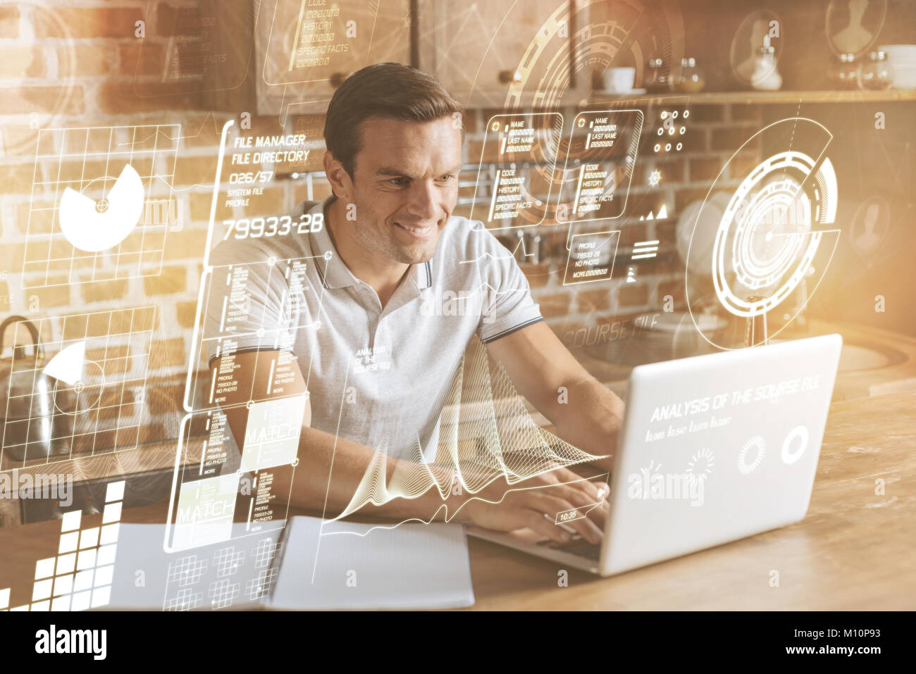 Positive man programming at home Stock Photo - Alamy