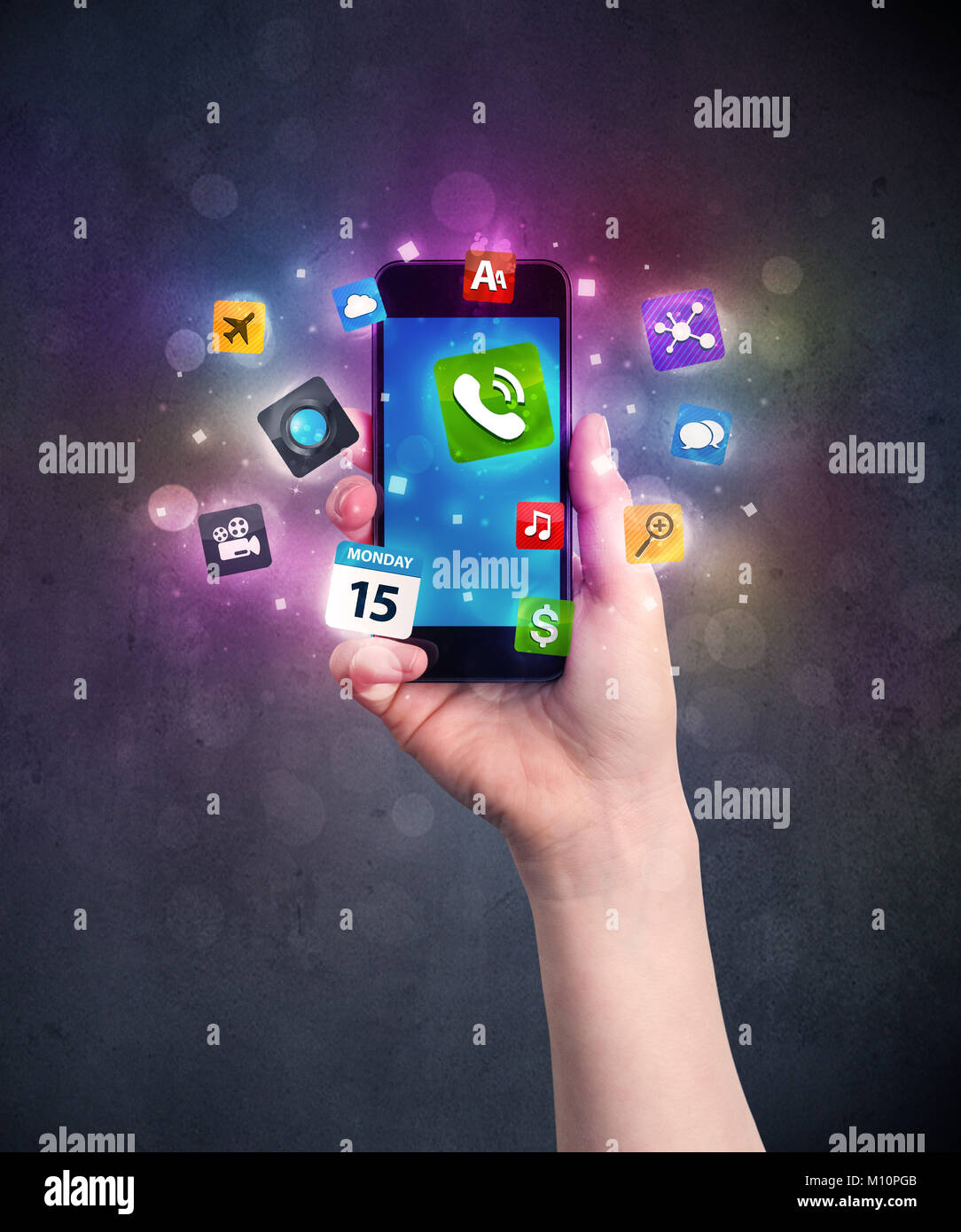 Caucasian hand in business suit holding a smartphone with colorful ...