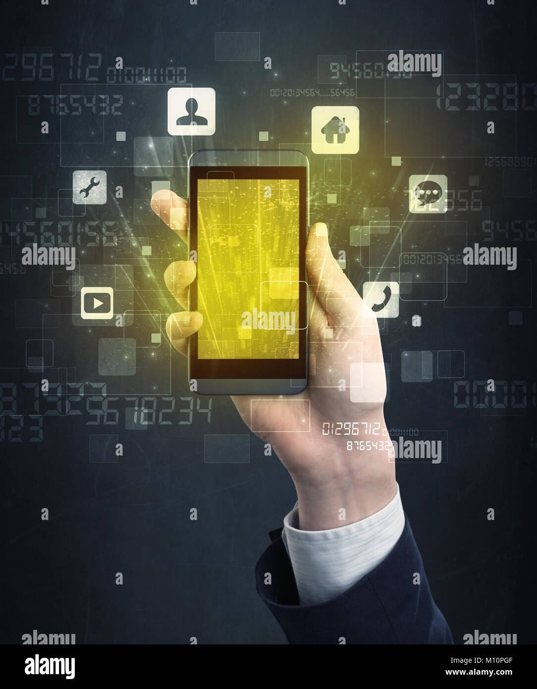 Caucasian hand in business suit holding a smartphone with golden-yellow ...