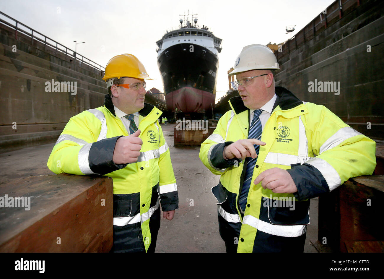 Energy Minister Paul Wheelhouse (left) with Michael Milne, managing director of Dales Marine Limited, during a visit to Leith Imperial Dry Dock where he announced the second round of funding for the Decommissioning Challenge Fund. Stock Photo